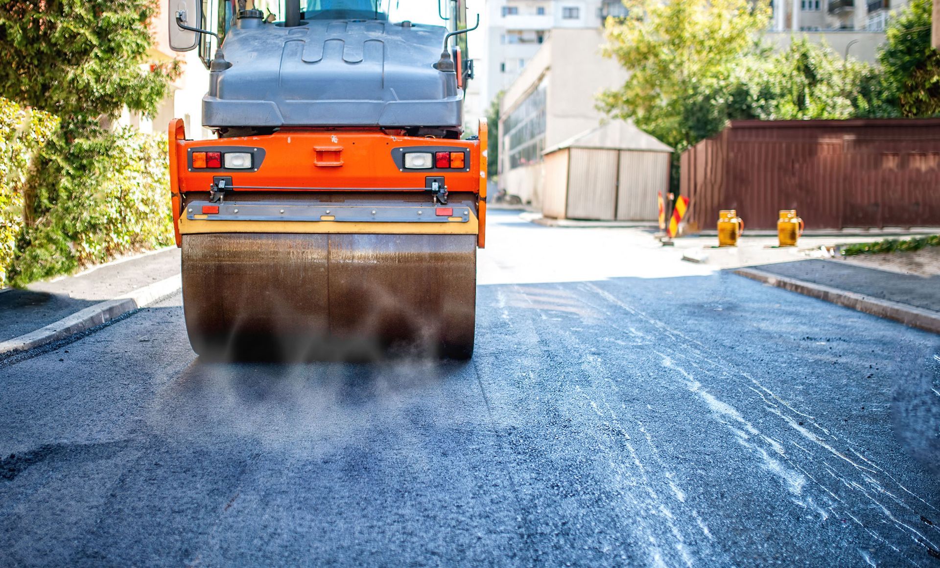 Road Solutions Paving crew preparing a fresh asphalt surface